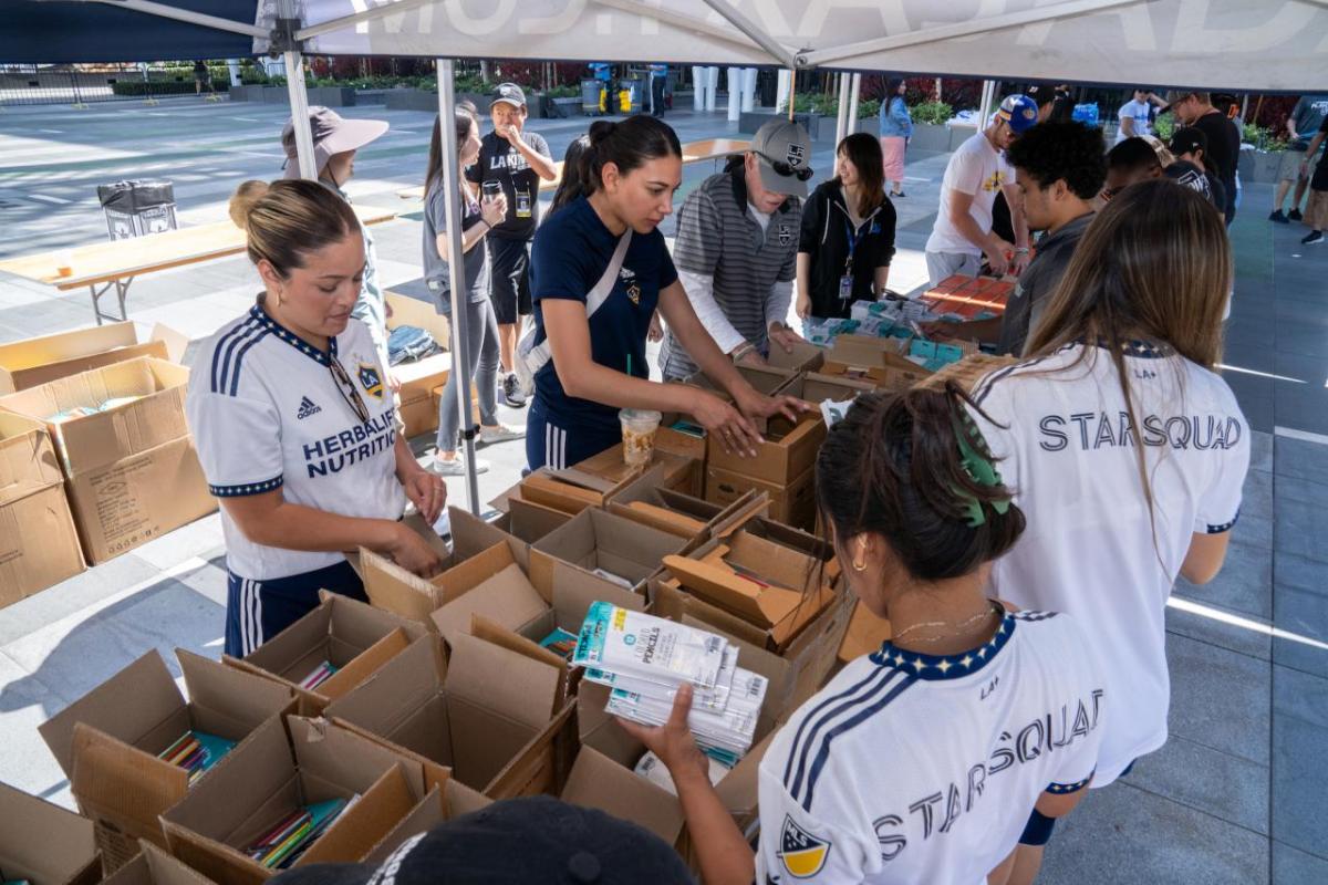 Volunteers from LA Galaxy helped pack backpacks filled with school supplies for students.