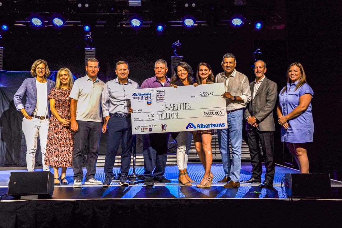 The 2023 Albertsons Boise Open presented by Chevron raised a record-breaking $3 million to support local Idaho charities. Group of people holding a check