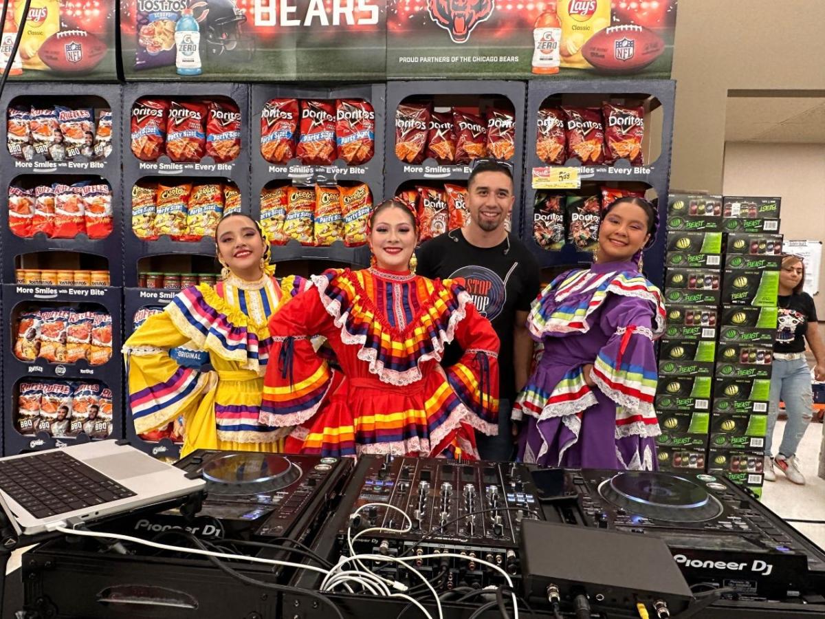 Group of people posing in store.