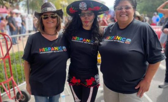Group of people pose for picture at Annual Chile & Frijoles Festival