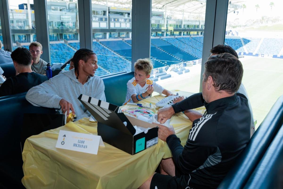 Galaxy players and coaches joined the children in decorating custom cleats.