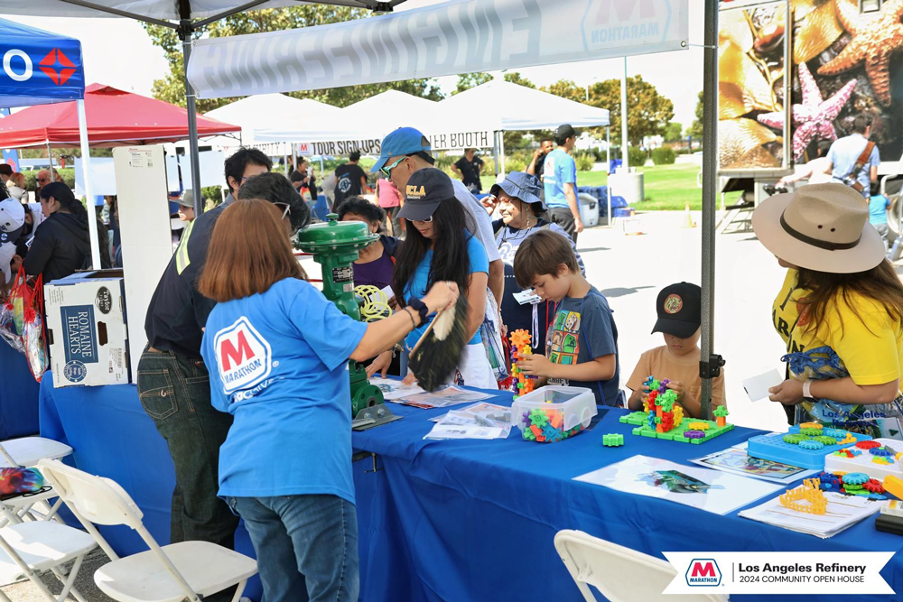 Kids and adults doing activities at an event table