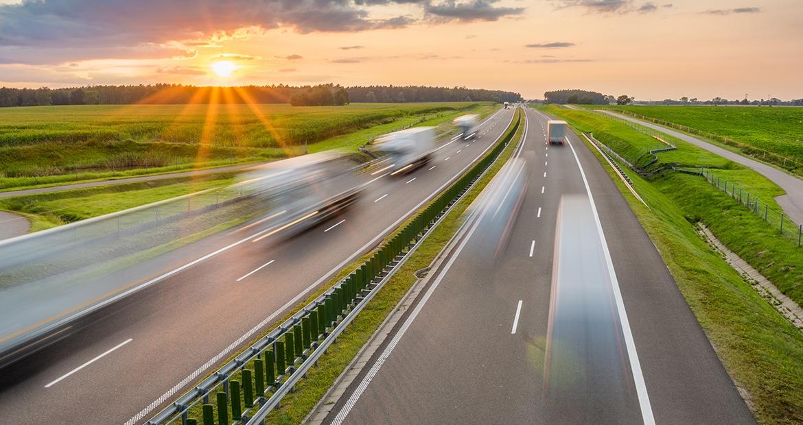 vehicles driving down a highway