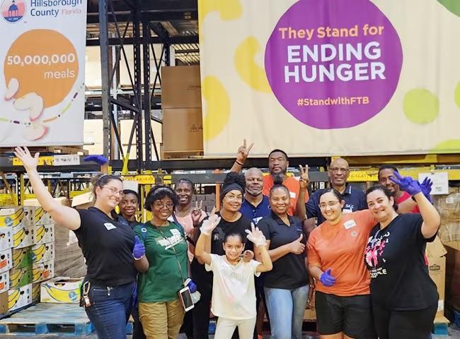 A group of volunteers posing for a photo