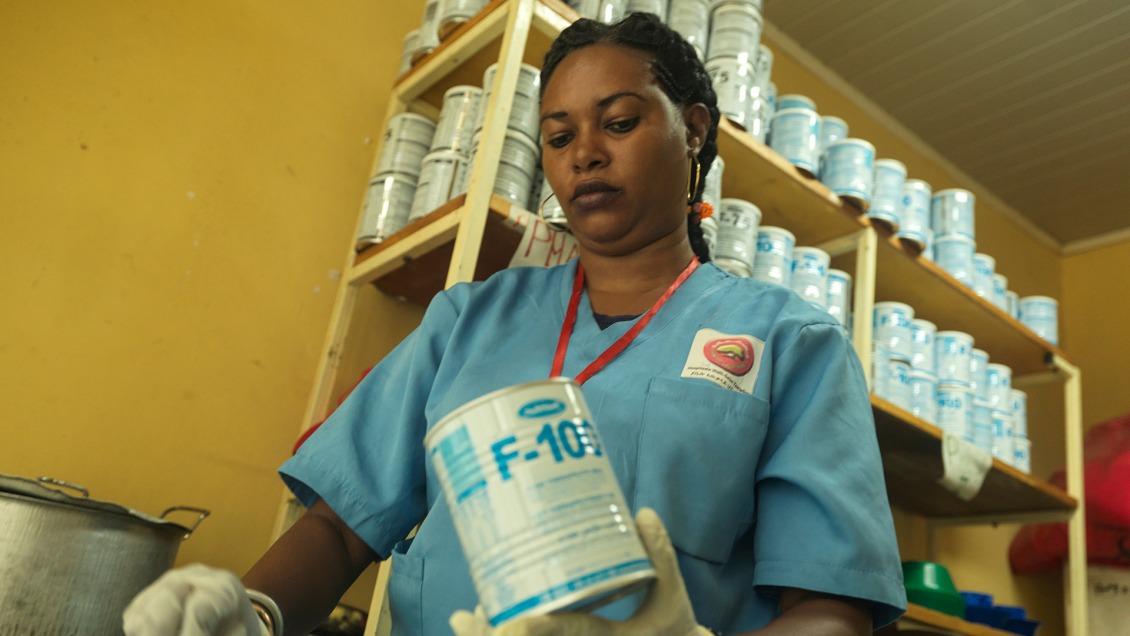 Action Against Hunger nurse Ware Arbale, 27, makes therapeutic milk to give to malnourished children.