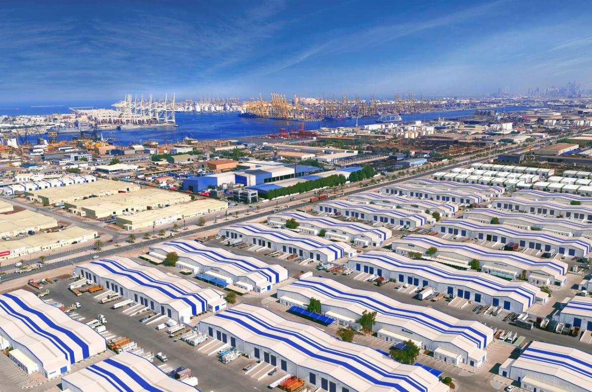 JAFZA has grown to more than 11,000 companies Aerial view of DP World’s Jebel Ali Free Zone in Dubai, showing expansive warehouses, logistics facilities, and the adjacent Jebel Ali Port with cranes and container ships along the waterfront.