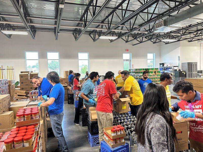 Albertsons associates packing up food boxes at North Texas Food Bank for donations.