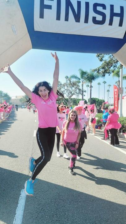 People pose at the finish line of the Orange County, CA Susan G. Komen More than Pink Walk.