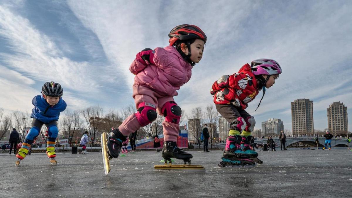 young children practice speed skating