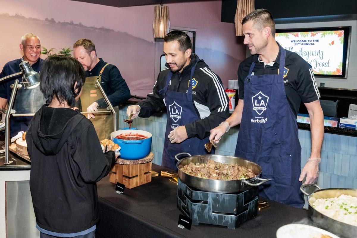 Urel Martinez, LA Galaxy's Chief Revenue Officer, and Thomas Braun, LA Galaxy's President and Chief Operating Officer, helped served Thanksgiving dinners to guests.