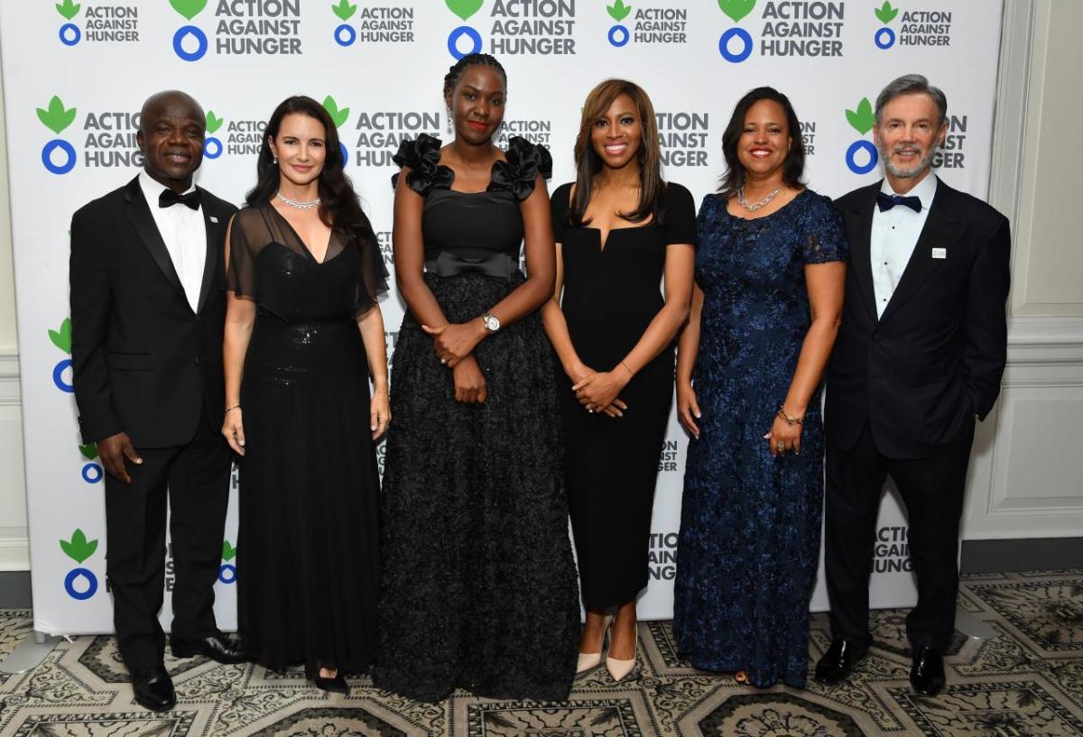 Dr. Charles Owubah, Kristin Davis, Ritah Kabanyoro, Zain Asher, Alicia Procello and Raymond Debbane pose for a photo. 