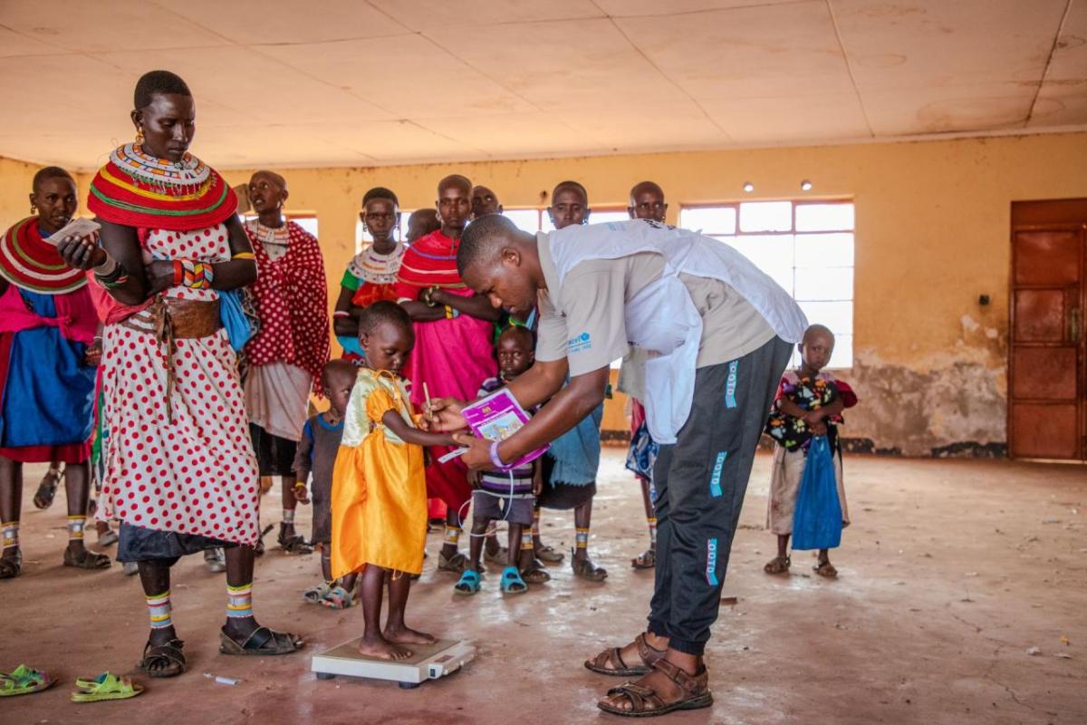 Rashei's weight is checked at the Action Against Hunger clinic. 