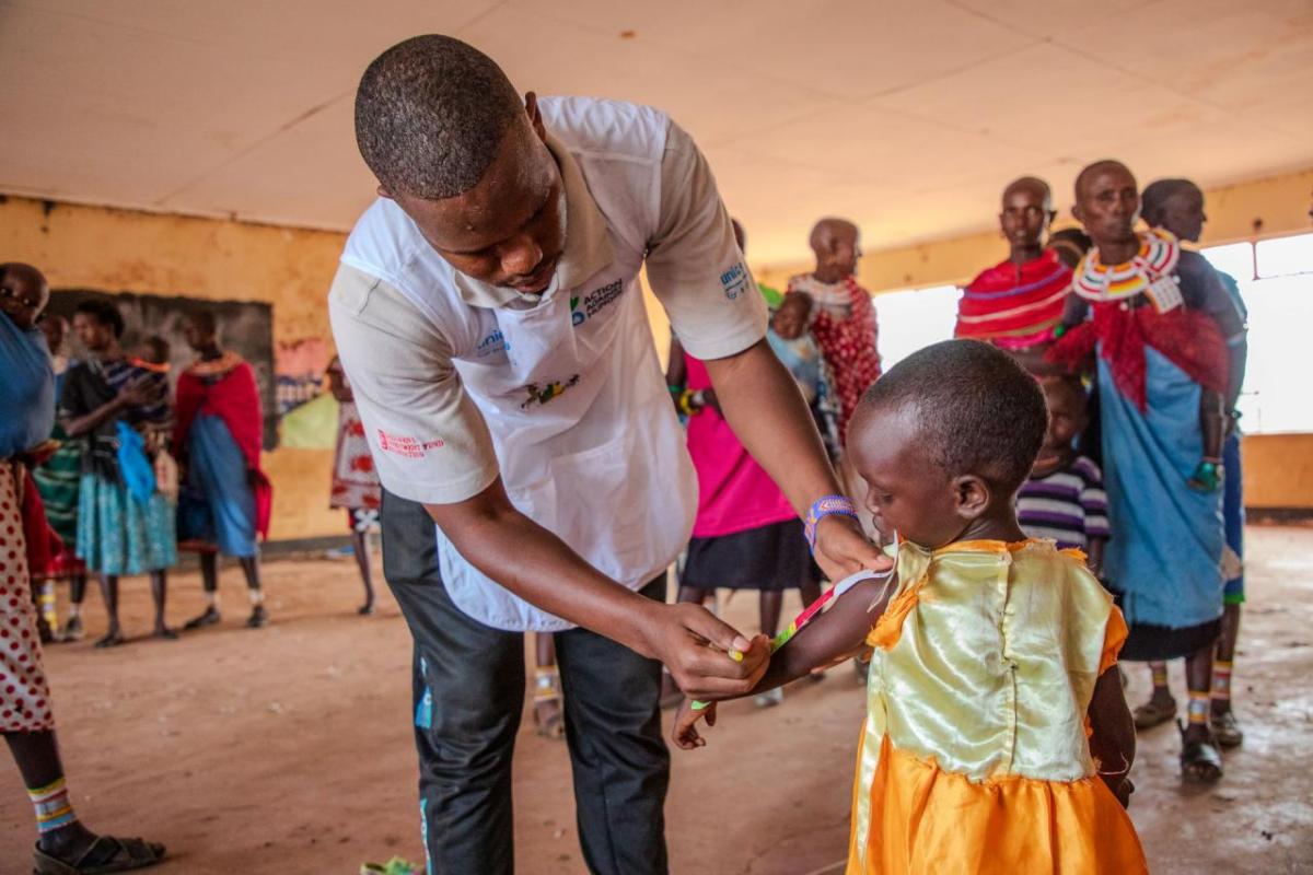 Rashei's MUAC measurement is taken at the Action Against Hunger outreach clinic. 