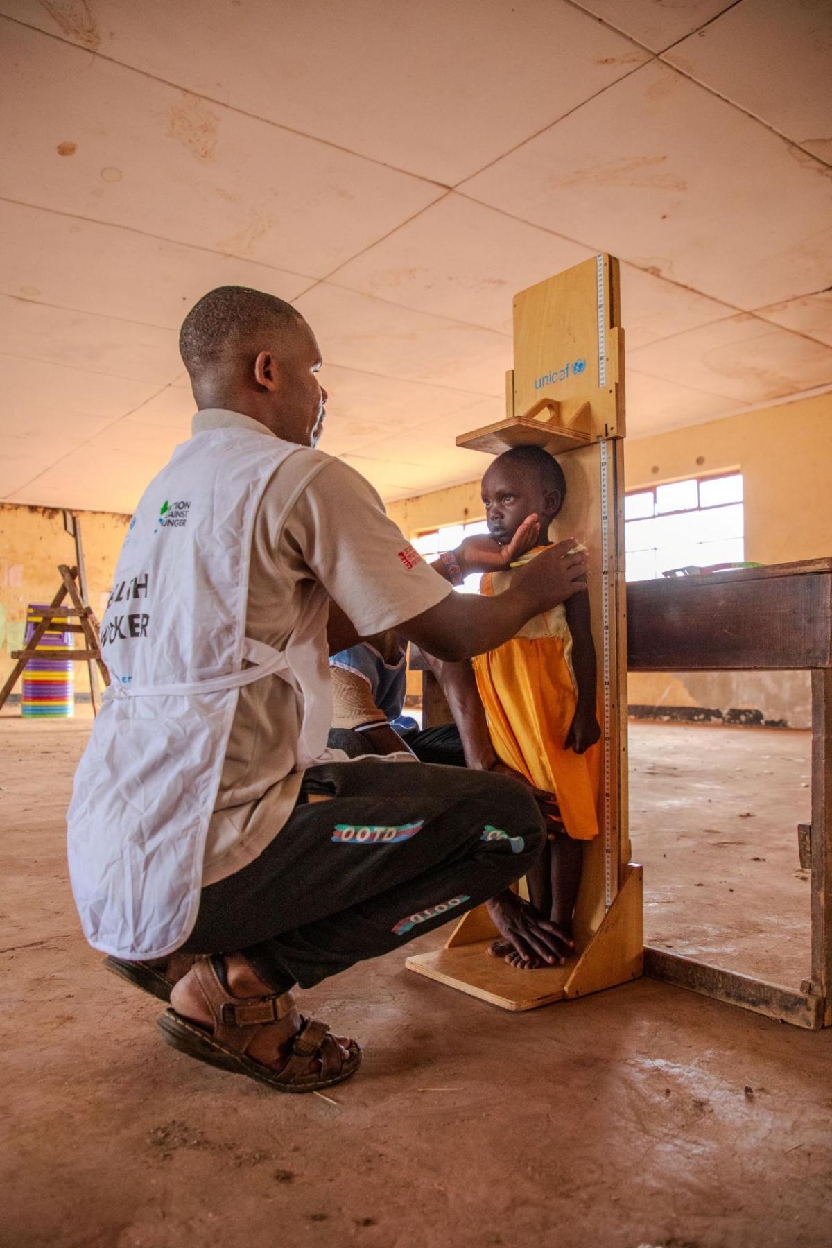 Rashei's height is checked at the Action Against Hunger clinic. 