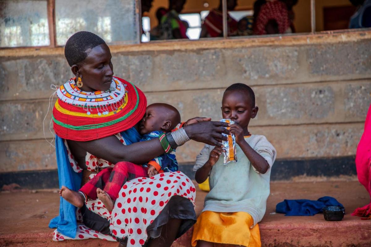 Rashei is fed RUTF by his mother at the Action Against Hunger clinic. 
