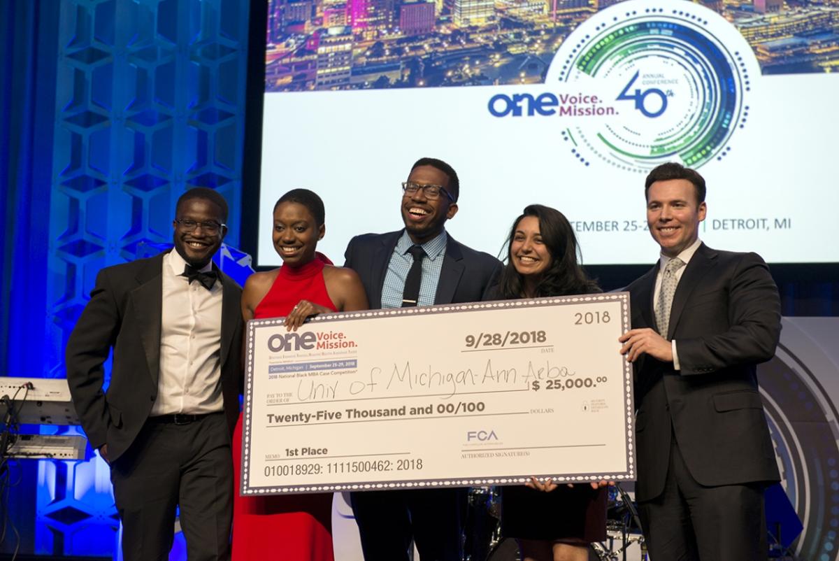 The National Black MBA Association Graduate Student Case Competition, sponsored by FCA US LLC, is an annual event which gives high-potential students an opportunity to demonstrate their knowledge and problem-solving skills in a formal competition. The 2018 national champions represented the University of Michigan, (l to r) Nicholas Thompson, Kristan Sock, Errington Bethel and Sheela Lal pictured here with Richard Cox, Head of Portfolio Planning and Head of Alfa Romeo and Maserati Product Planning, FCA - North America.