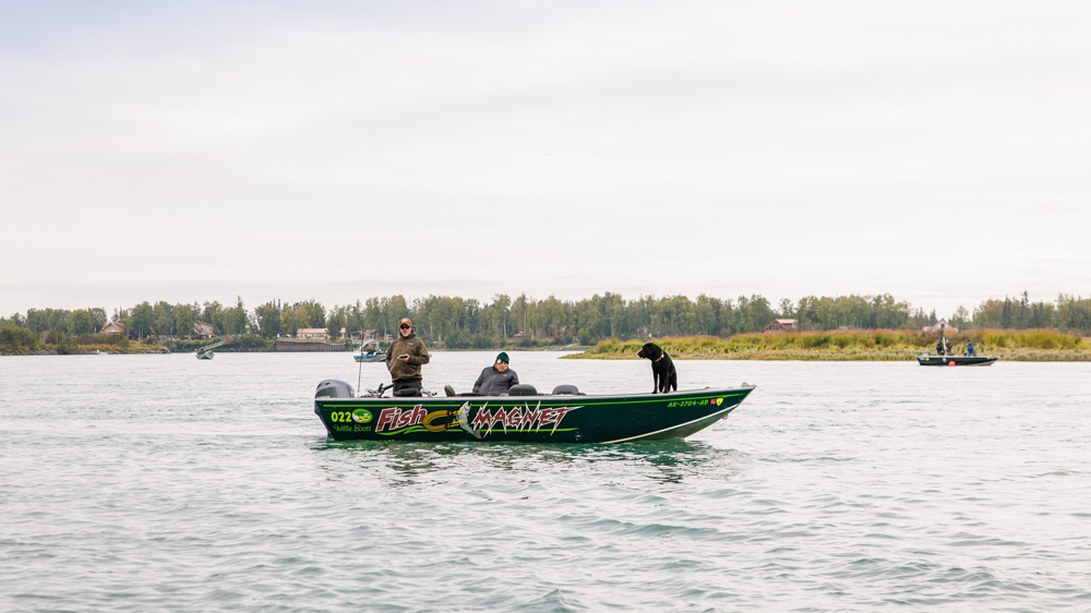 people in a boat on a river