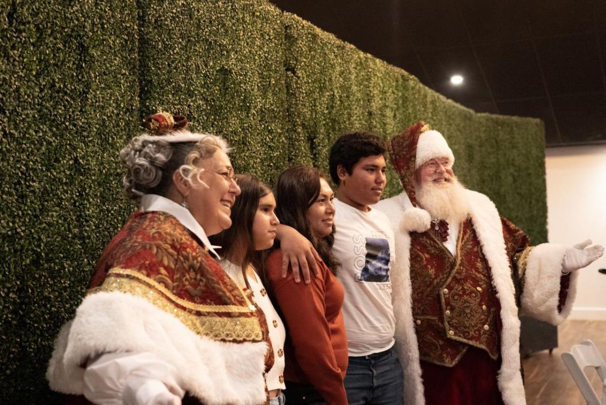 Mr and Mrs. Claus visited families at the Holly Jolly Thanksgiving Dinner.