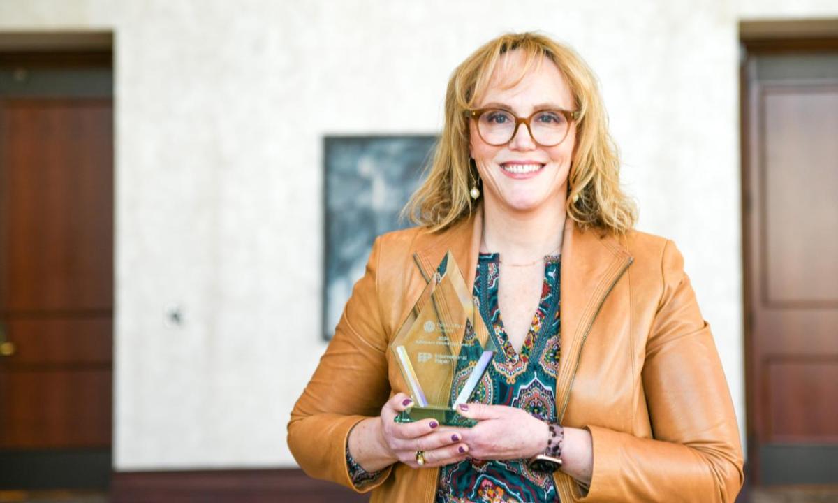 Person holding an award