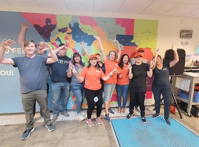 A group of volunteers posing for a photo