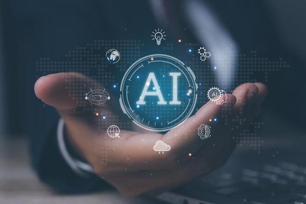 Photo courtesy of GETTY. Hand with bubble that says "AI"