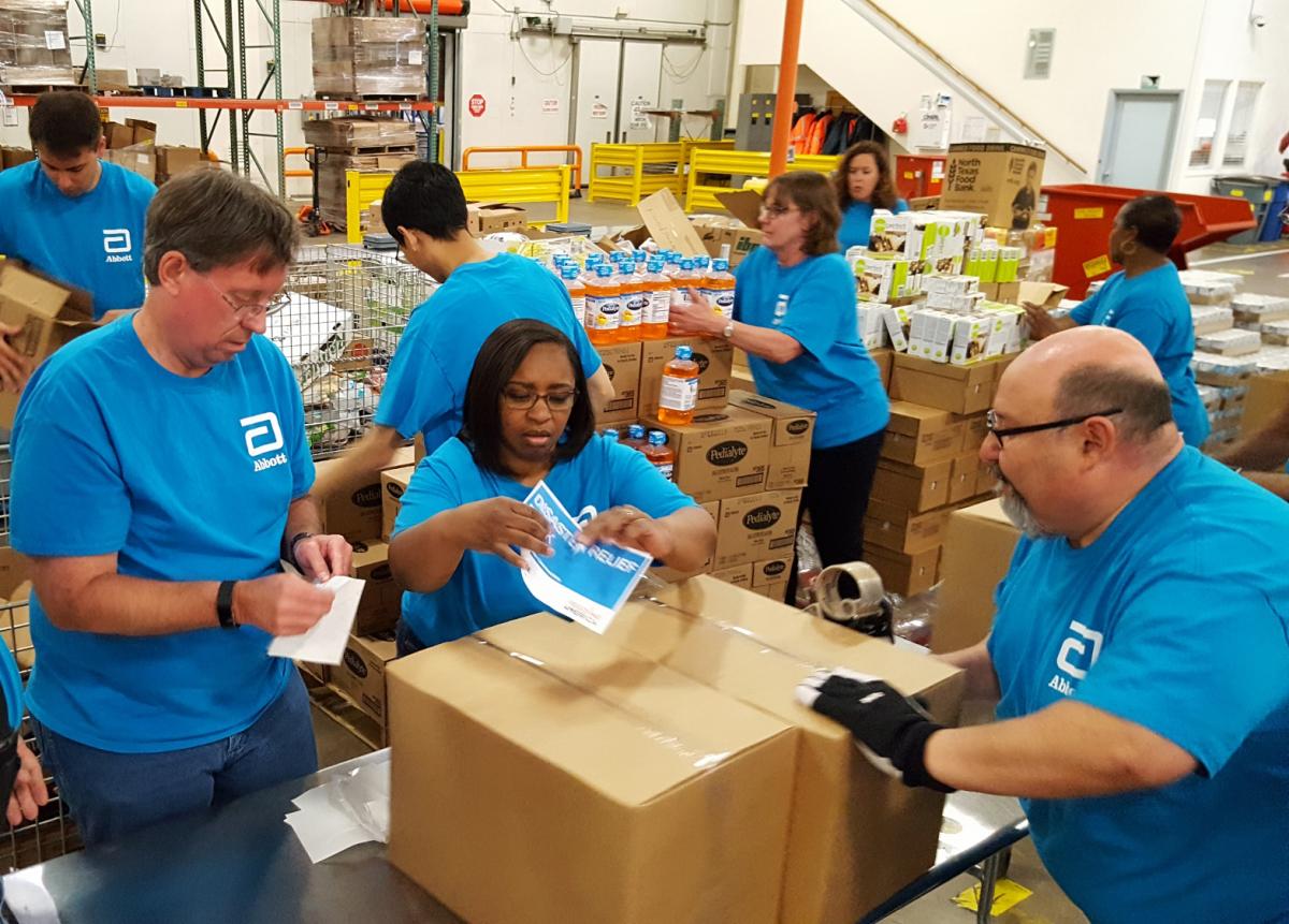 Abbott volunteers prepare 'disaster relief packs' for food banks prior to hurricane season. These packs helped communities respond quickly to hurricanes.