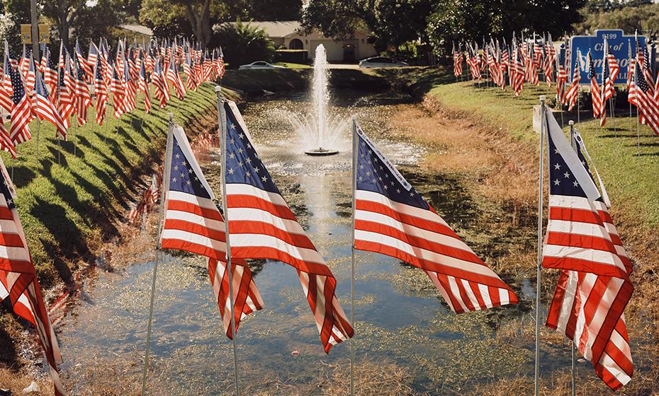 American flags surrounding a fountain