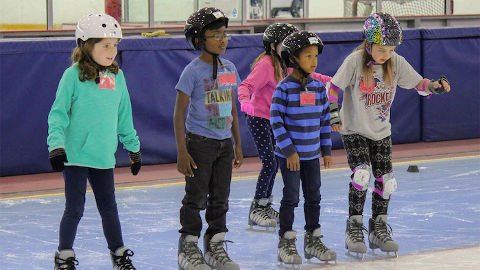 Youth skating indoors