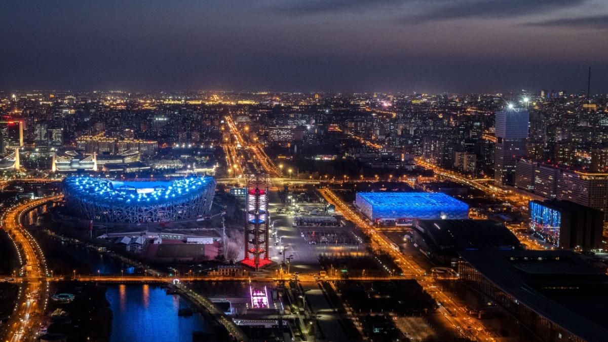 Beijing at night lit up in blue and orange lights