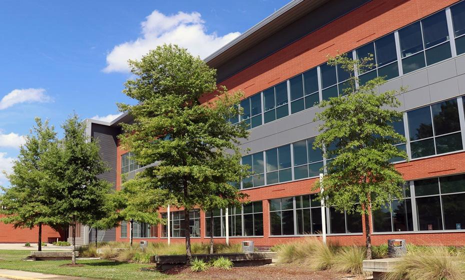 large building with trees in front