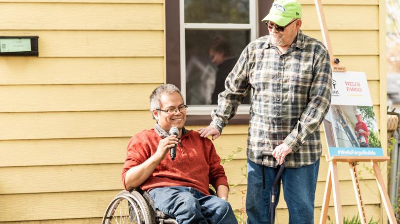 Homeowner with man in wheelchair