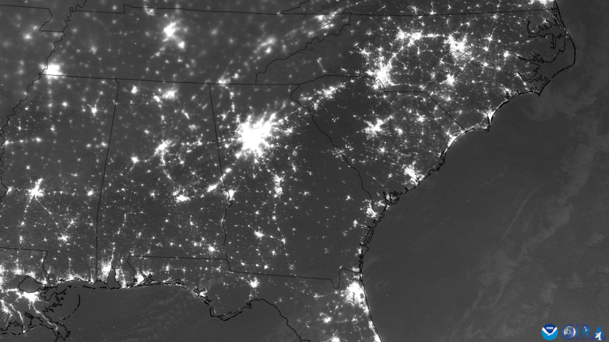 Power outages across several states in the southeast U.S. outline the path Hurricane Helene took as it traversed inland. (Power outages across several states in the southeast U.S. outline the path Hurricane Helene took as it traversed inland. (NOAA satellite imagery) imagery) dark map of united states showing areas of black outs.