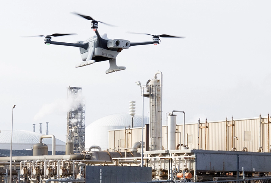 Drone flying over factory