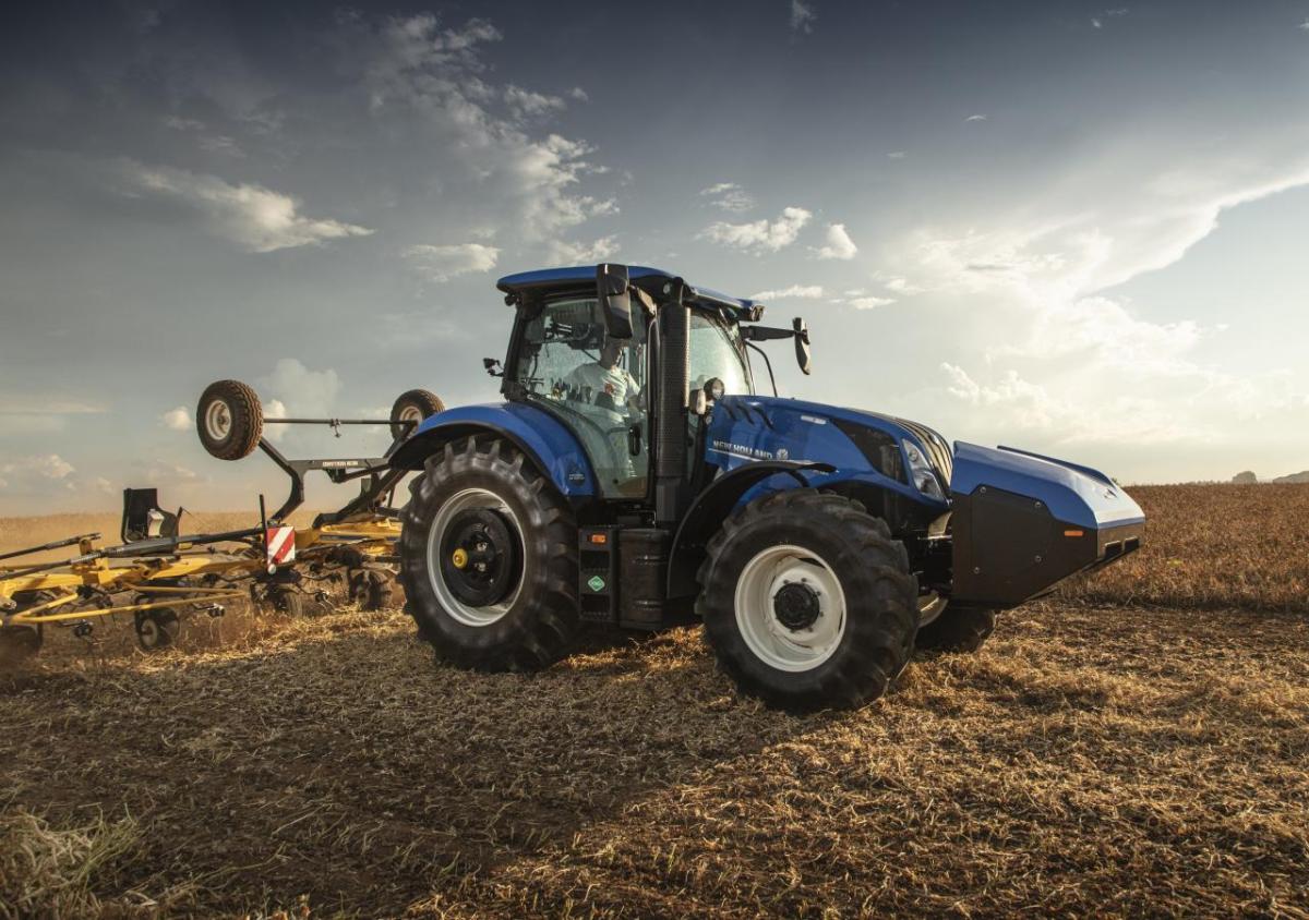 A blue tractor in a field