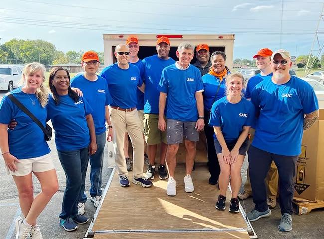 A group of volunteers wearing blue t-shirts 