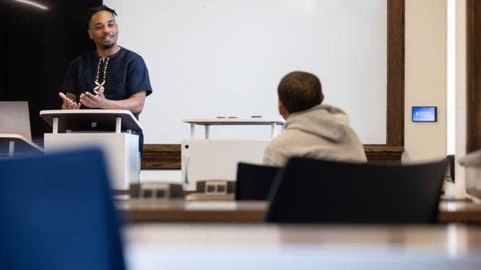 A person teaching a student