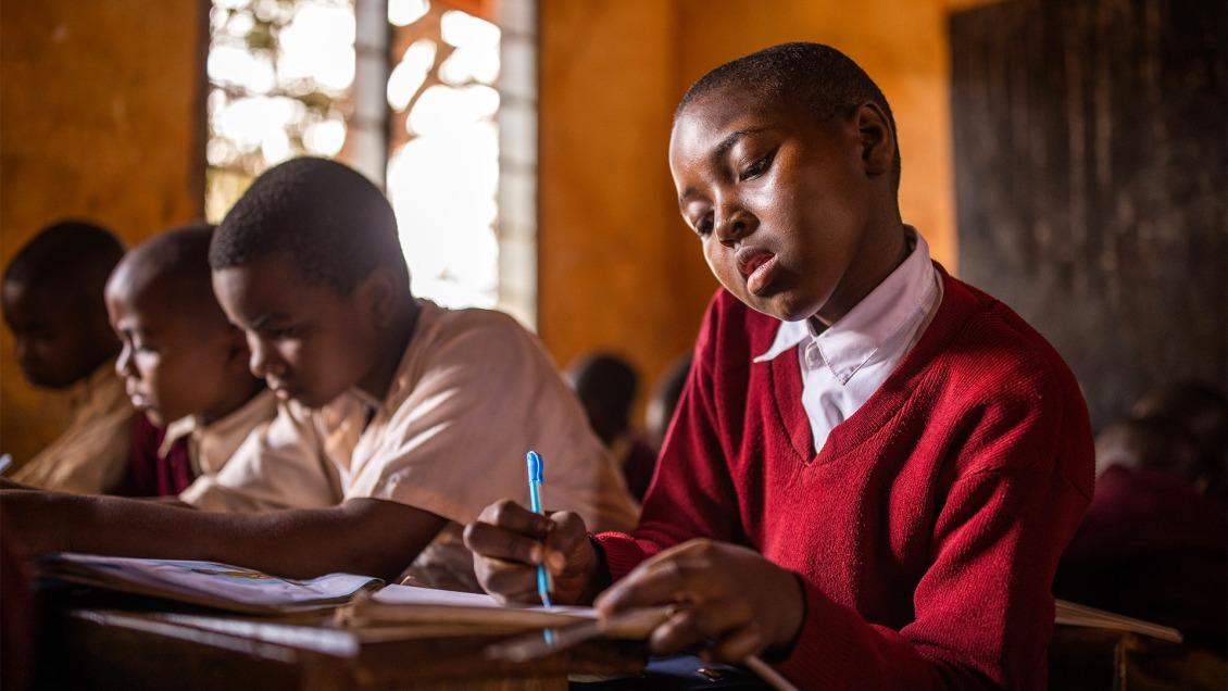 Suzana, 9, in her classroom in Tanzania.