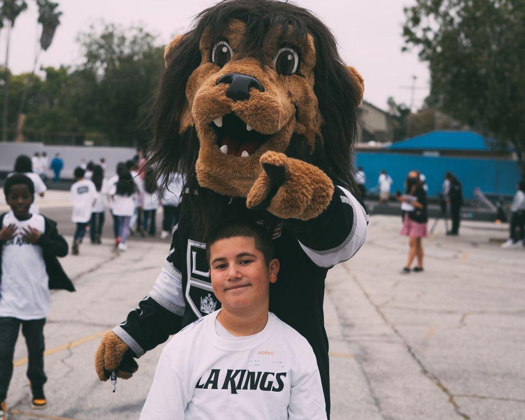 LA Kings mascot Bailey joins the students for a ball hockey clinic led by the LA Kings Hockey Development team.
