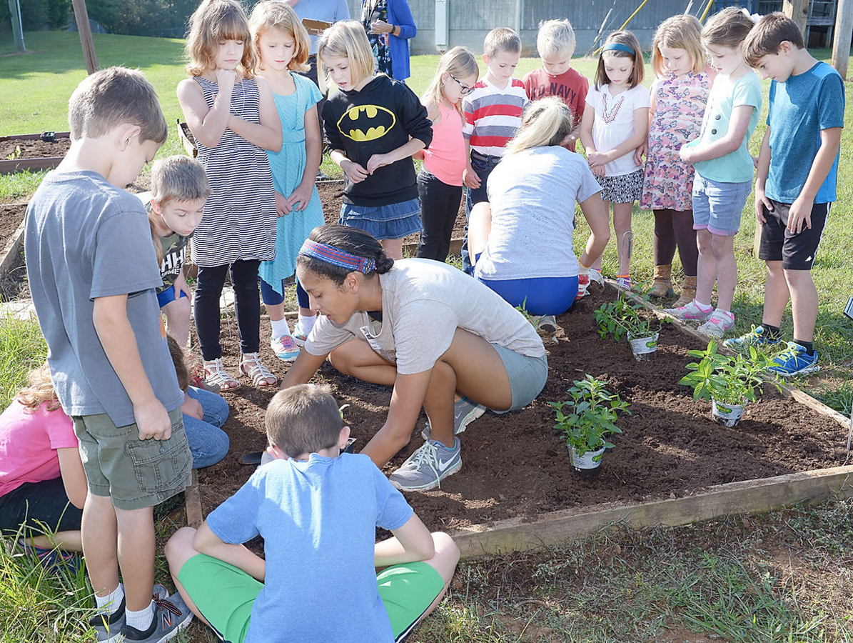Keep Blount Beautiful Executive Director Alanna McKissack working with students at the Montvale Elementary School Community Edible Garden in Maryville, Tennessee.