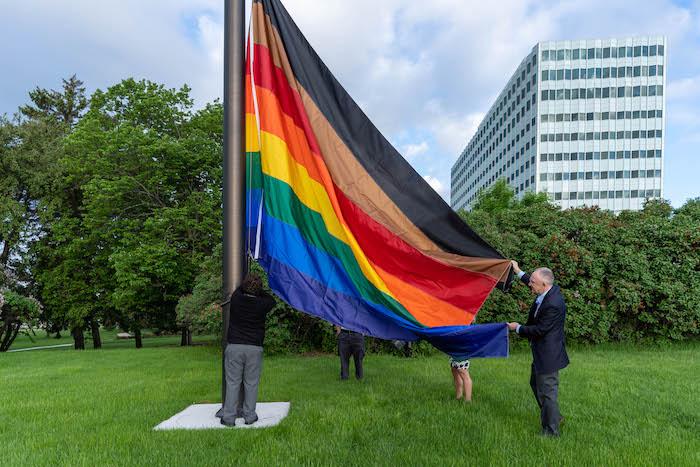 Peter Gibbons, group president of Enterprise Operations and 3M Pride executive sponsor, raising the Pride flag outside 3M Center in Maplewood, Minnesota.