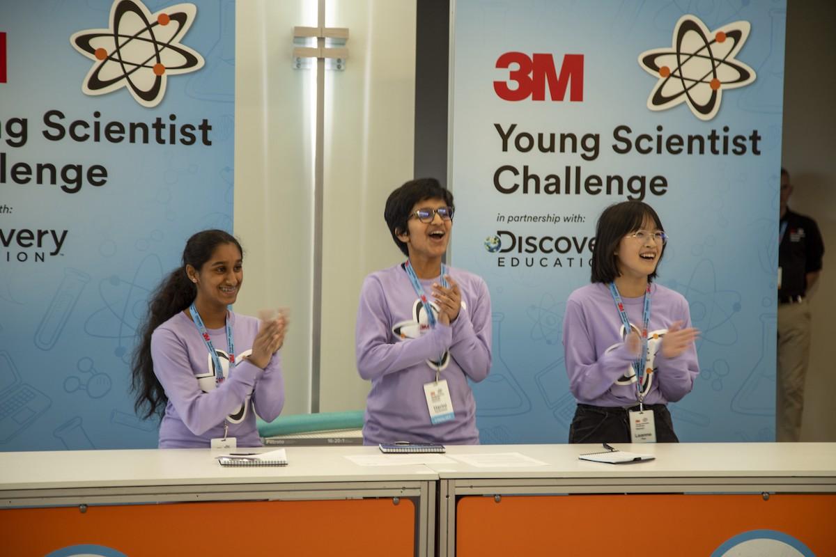 3M Young Scientist Challenge. Three student shown on a panel.