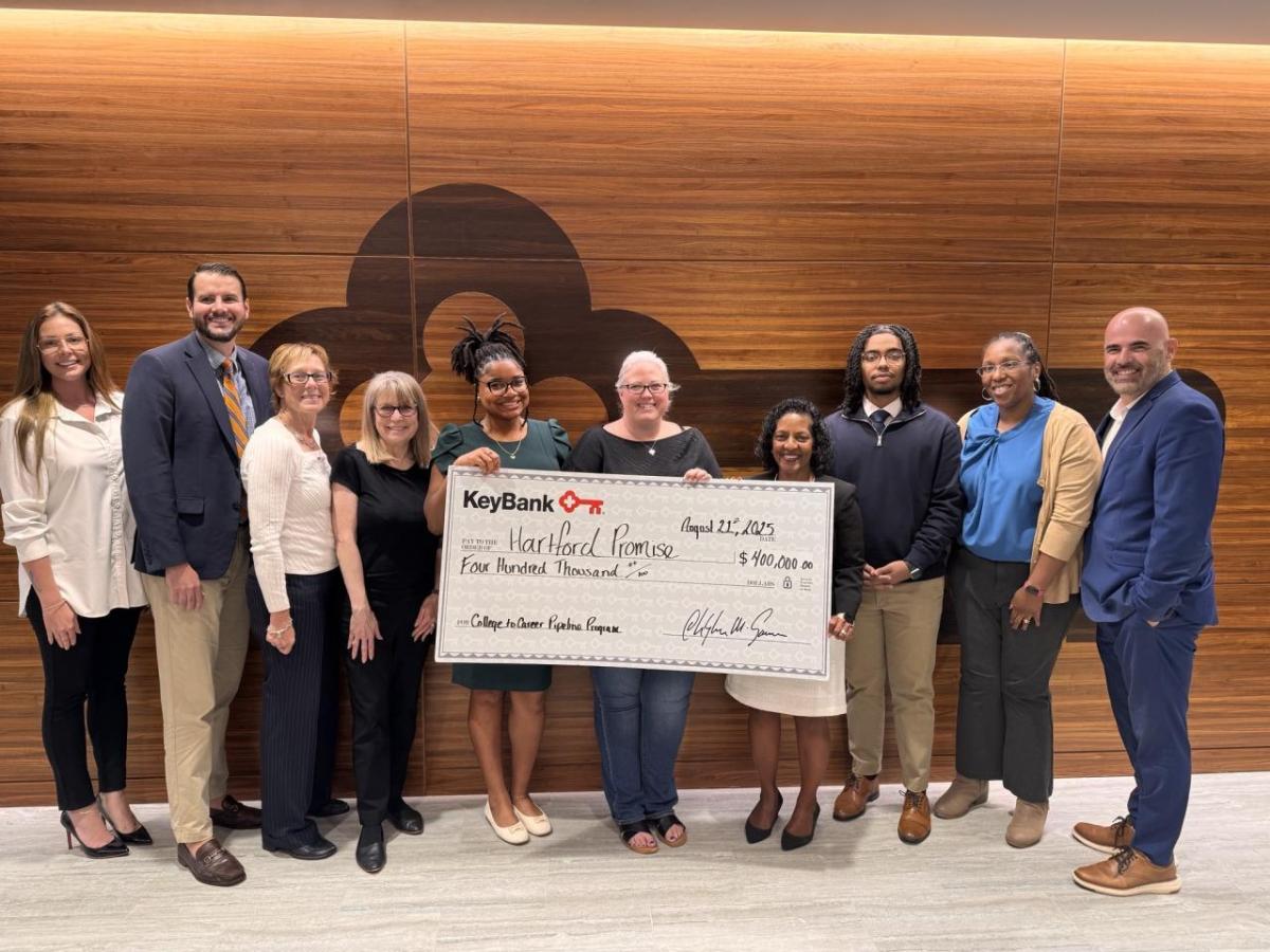KeyBank teammates presented Hartford Promise President Sivan Hines and College to Career Pipeline participants with a $400,000 gift. The highlight of the event was a conversation between Key employees and the Hartford area students, with each sharing their life journey and ambitions. " "
