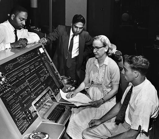 Grace Hopper, American computer scientist, at an early computer