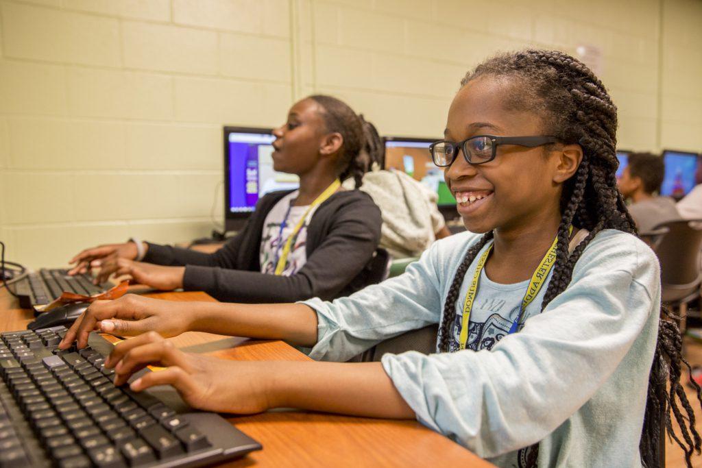 Photo Credit: The 50 State Afterschool Network Girls typing at keyboards