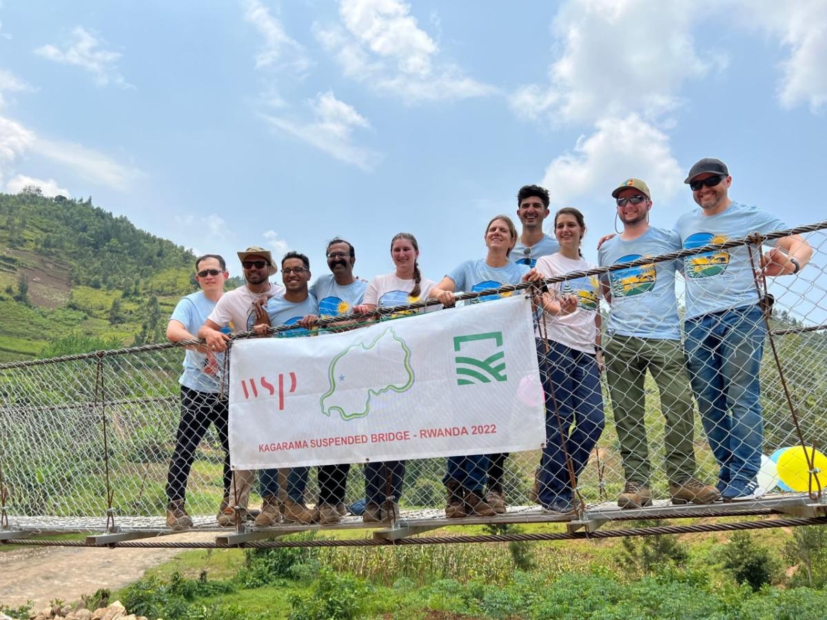 Bridges to Prosperity 2022 Team posing on Kagarama Suspended Bridge in Rwanda