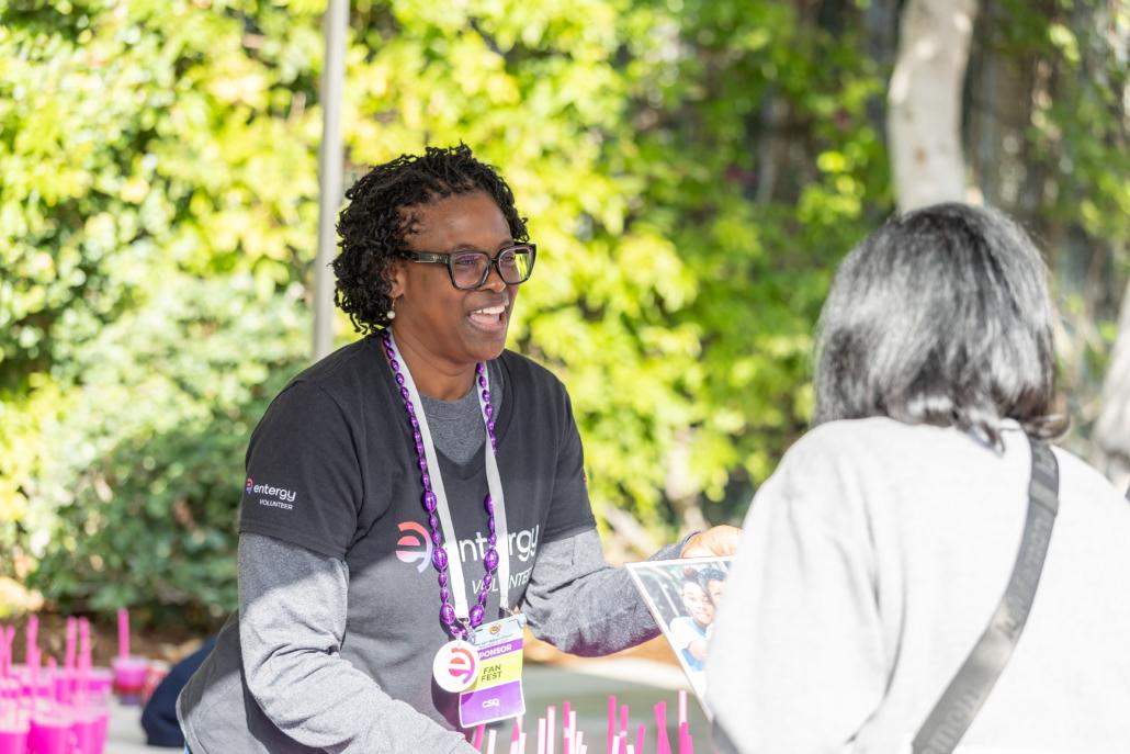 people speaking to each other at a booth