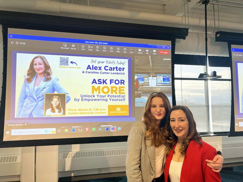 Columbia Law School professor Alexandra Carter and her daughter Caroline Carter Lembrich in front of a projector screen