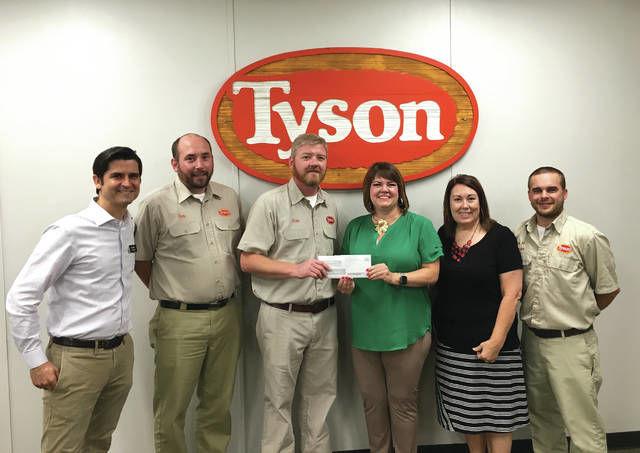 Tyson Foods recently awarded a $40,000 grant to The Food Bank for Central and Northeastern Missouri for a mobile food pantry program. From left, Eric Maly (Food Bank), Ben McFarlin (Tyson), Alan Johnson (Tyson), Lindsay Lopez (Food Bank), Melissa Schulte (Food Bank) and Dustin Tippin (Tyson). <em>Photo courtesy of The Food Bank for Central and Northeastern Missouri</em>