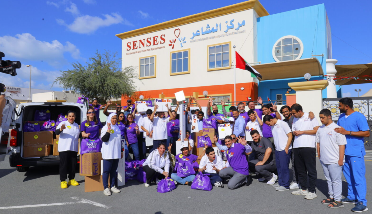 A group photo of people in front of a building 