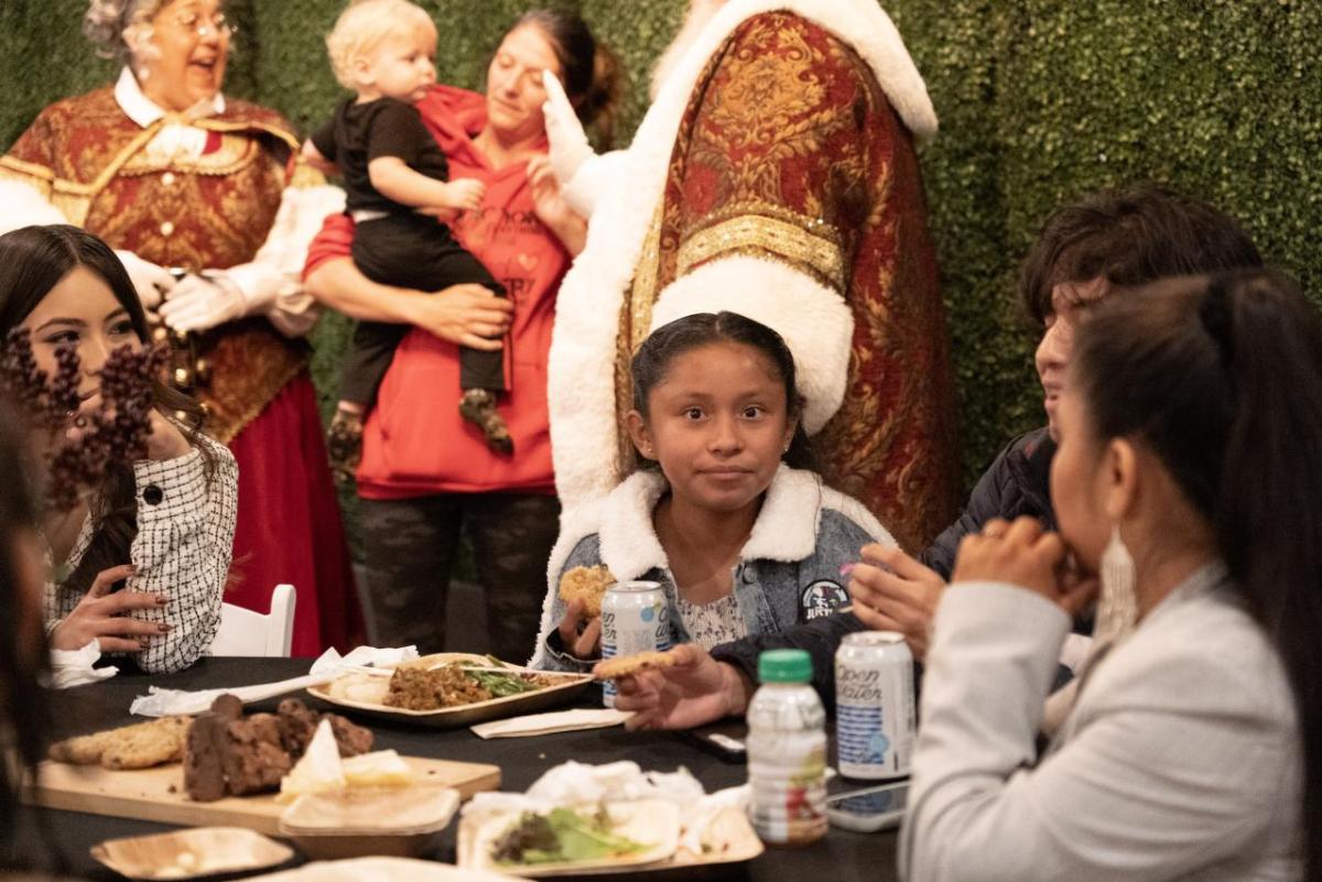 Families at the Holly Jolly Thanksgiving Dinner enjoyed full Thanksgiving meals and a visit from Santa Claus.